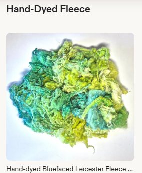 A picture of a pile of blue, green and yellow curls with the text Hand-dyed Fleece above it 